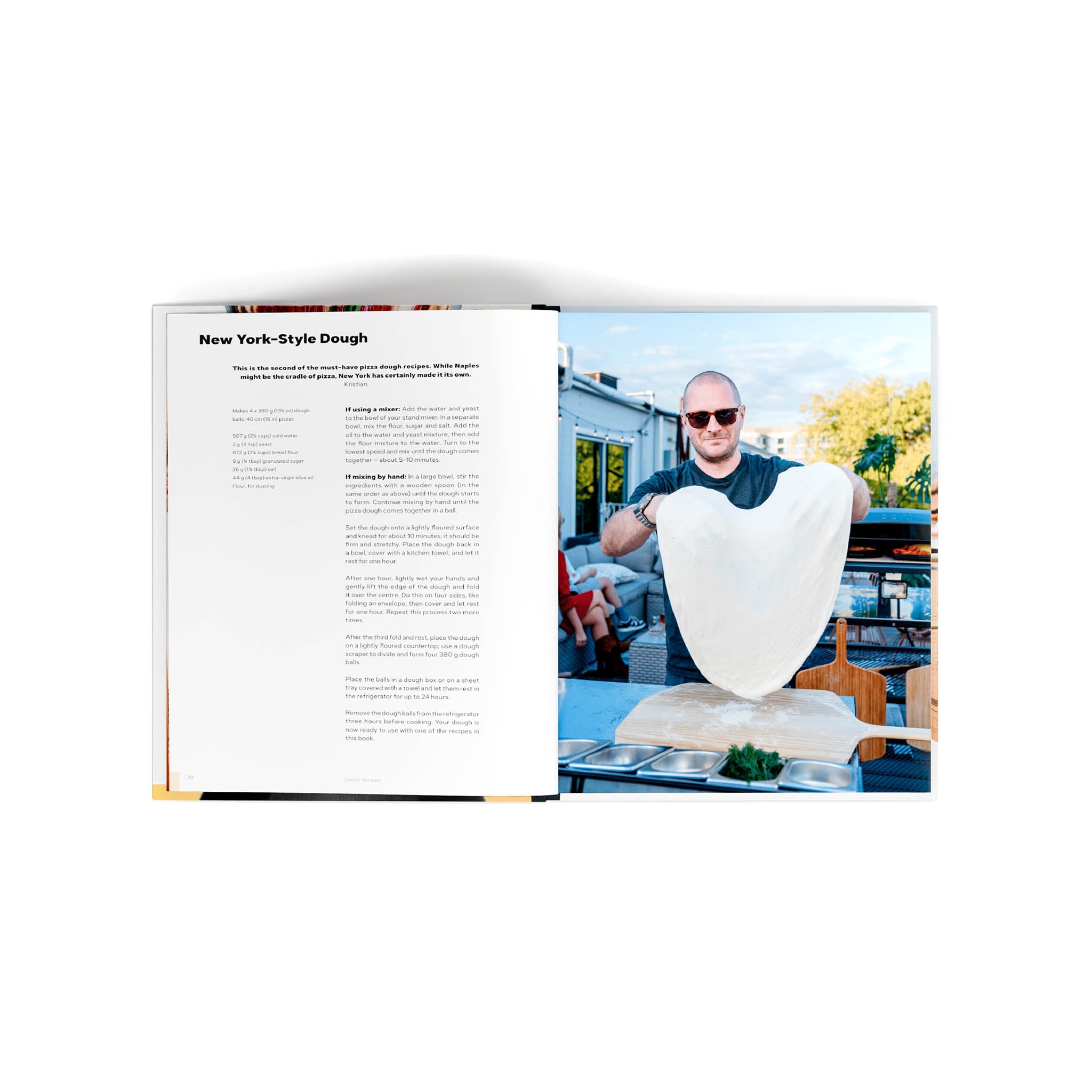 Cooking with Ooni Cookbook open to page with New-york style pizza dough recipe.