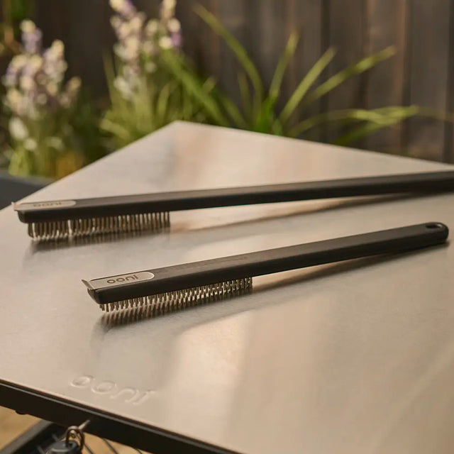 pizza oven brush, short and long side by side on modular table 