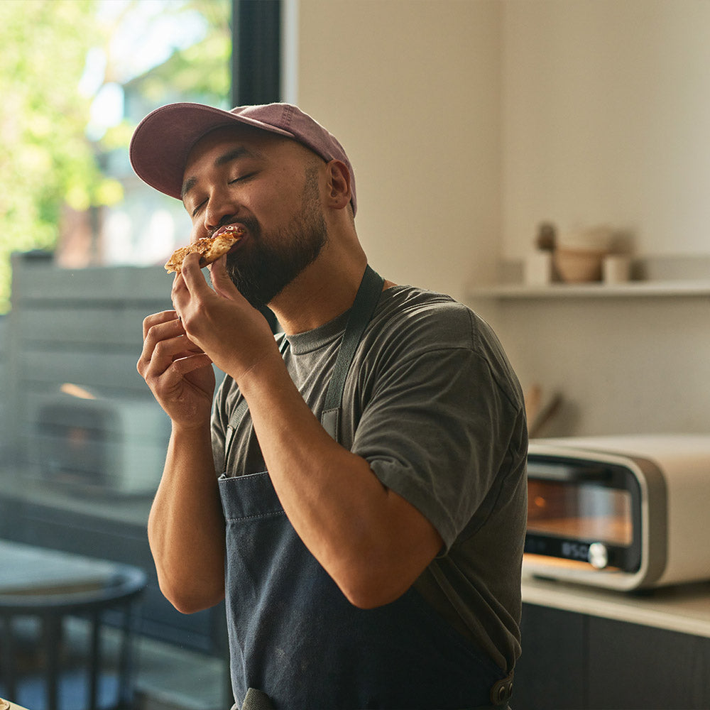 Person eating pizza