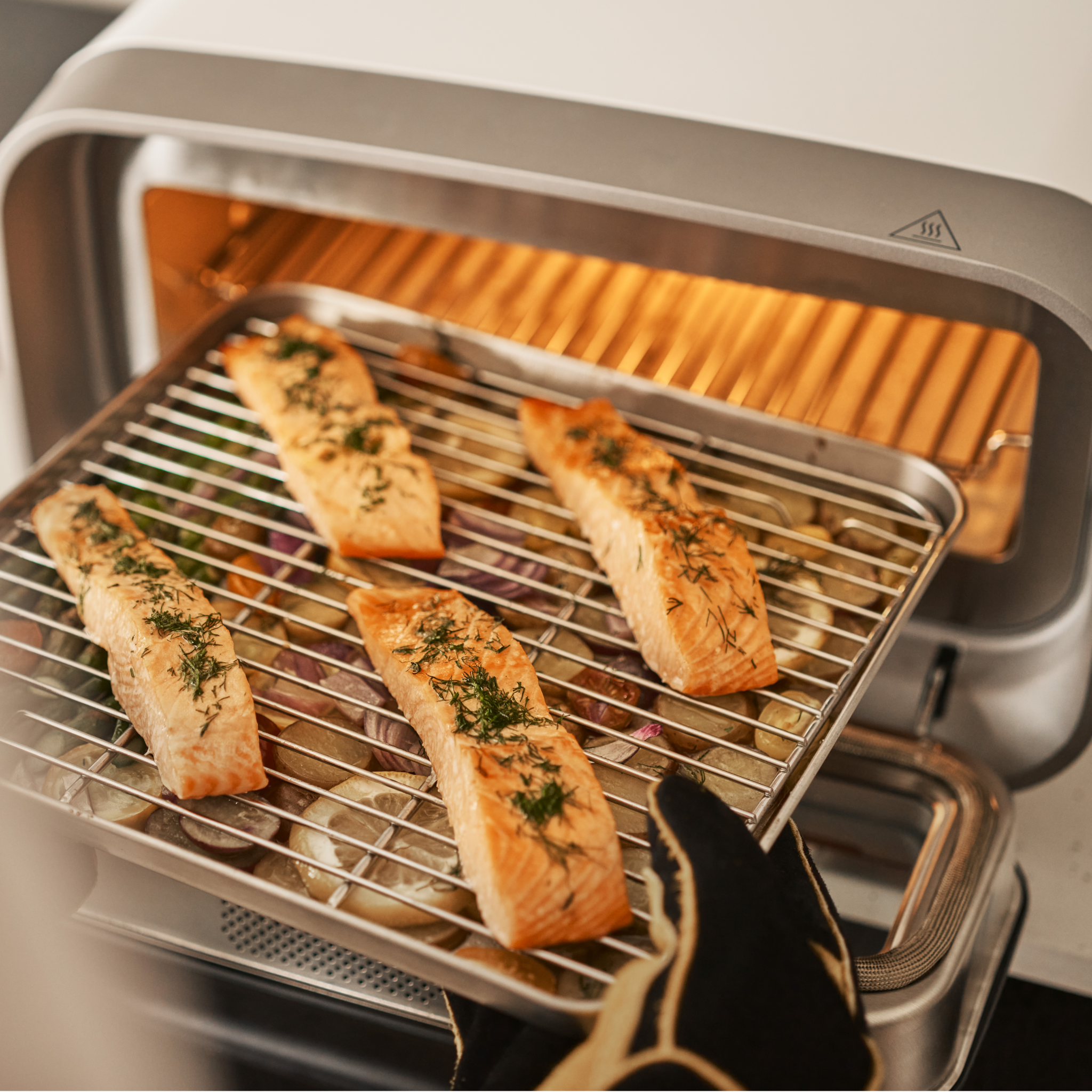 salmon fillets cooking on sheet pan and rack for ooni volt 2 